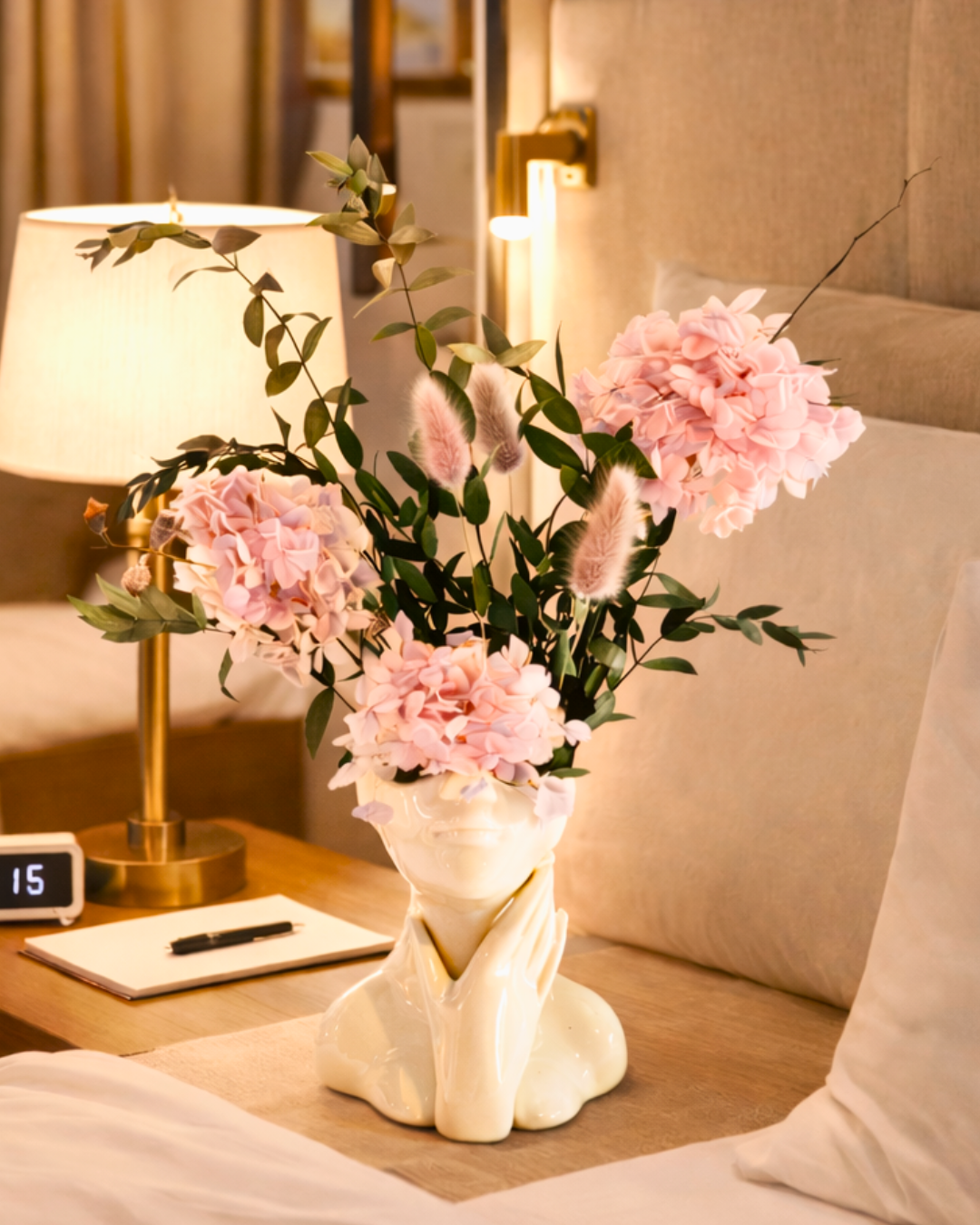 Decorative vase with pink preserved flowers on a bedside table | Fleur Reverie | Austin TX