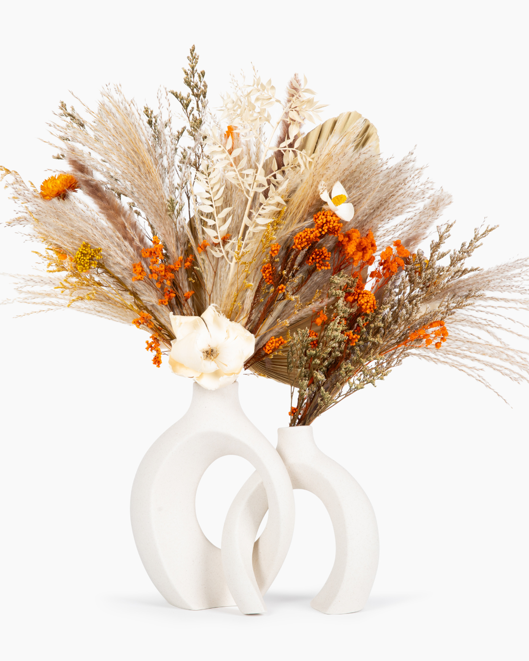 Decorative interlock vases with dried flowers and preserved flowers on a white background | Fleur Reverie