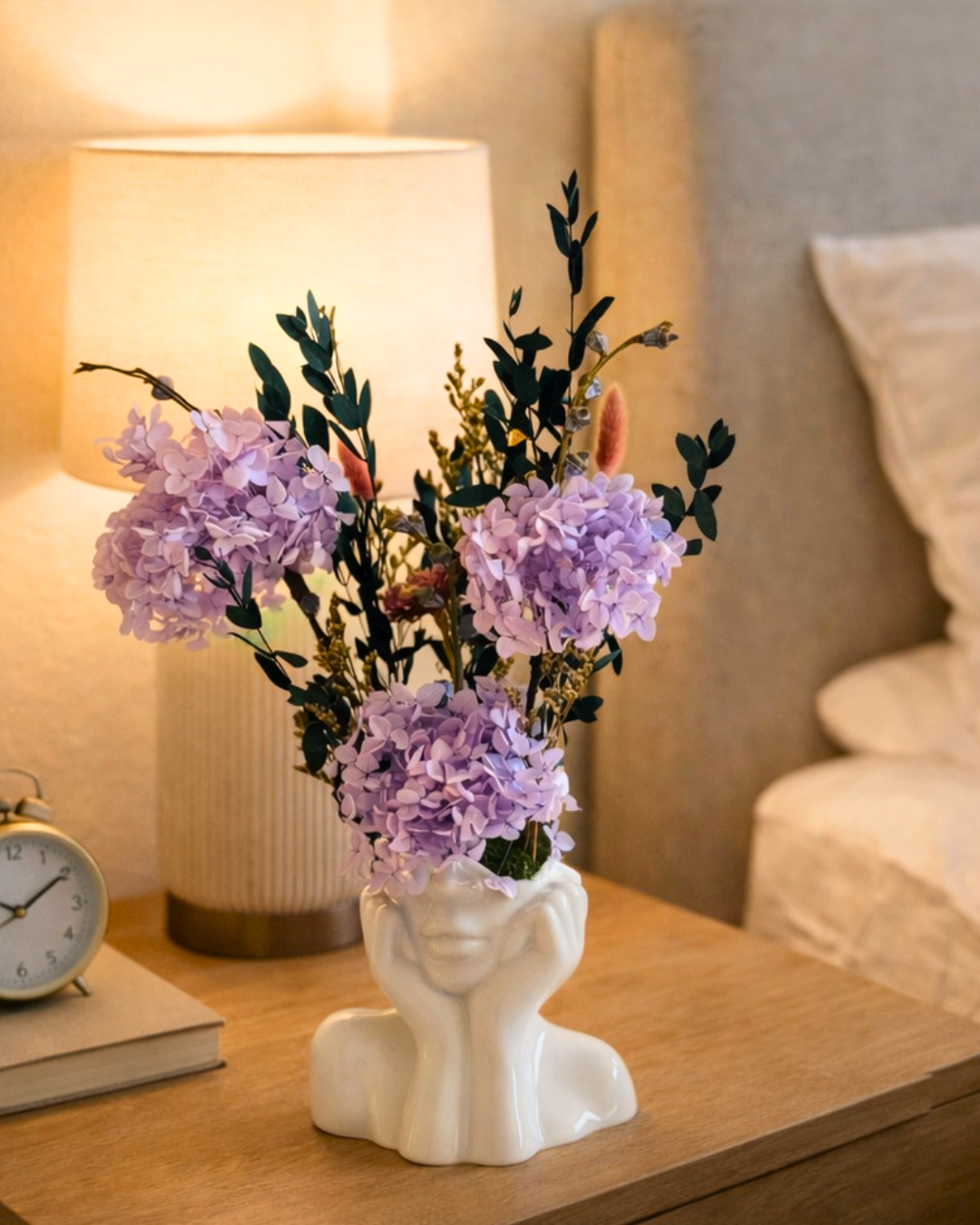 Decorative vase with purple dried flowers on a bedside table next to a lamp | Fleur Reverie | Austin TX