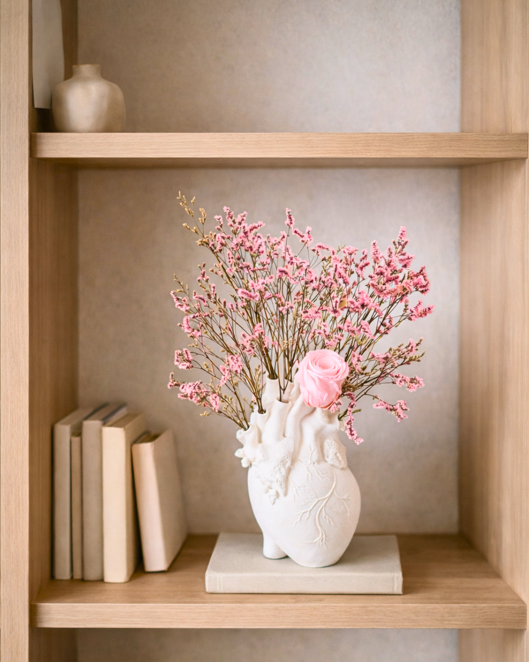 Decorative vase with pink dried flowers on a wooden shelf | Fleur Reverie | Austin TX