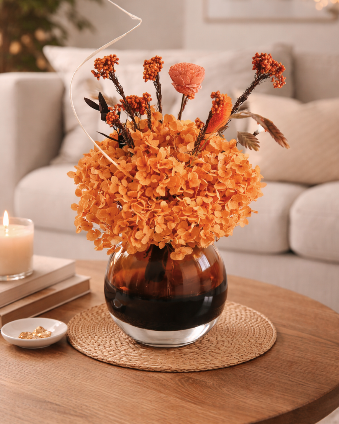 Decorative vase with orange dried flowers on a wooden table in Austin TX | Fleur Reverie