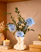 Decorative vase with blue preserved flowers on a shelf | Fleur Reverie | Austin TX