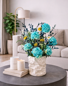 Decorative vase with blue preserved flowers on a coffee table | Fleur Reverie | Austin TX