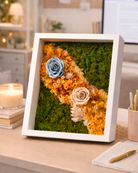 Framed moss wall art with flowers on a desk | Fleur Reverie