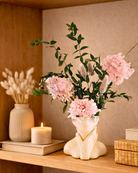 Decorative setup with pink flowers in a vase on a shelf | Fleur Reverie | Austin TX