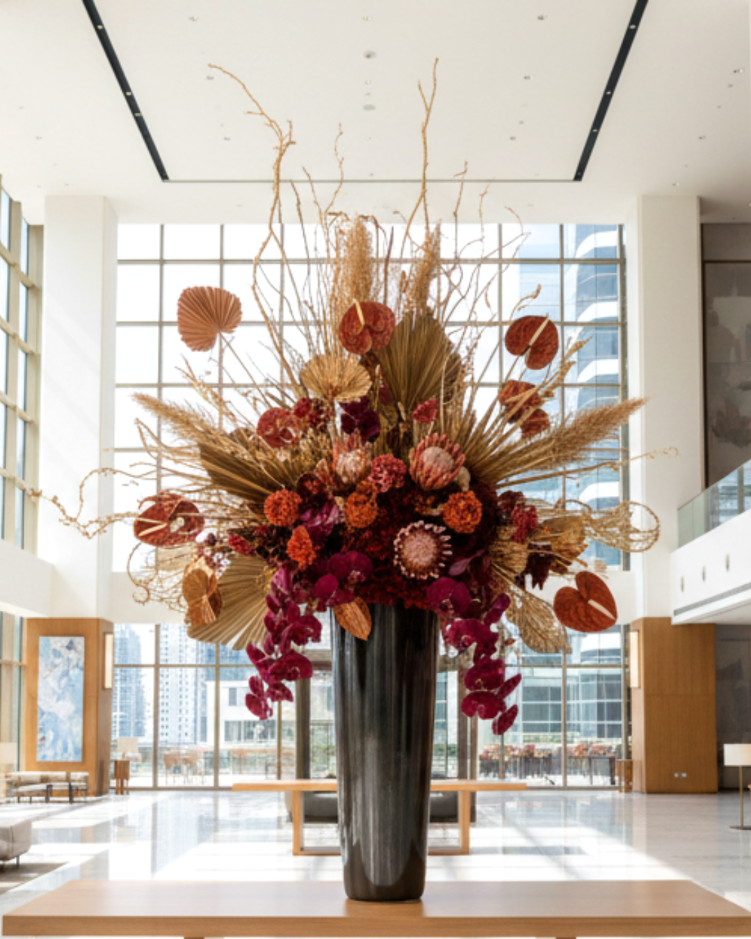 Large preserved floral arrangement in a modern indoor setting with large windows | Fleur Reverie | Austin TX