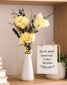 Bouquet of yellow preserved flowers in a white vase with a motivational sign on a shelf. | Fleur Reverie