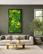 Preserved moss wall art in Living room with a gray sofa, and a wooden coffee table | Fleur Reverie | Austin TX