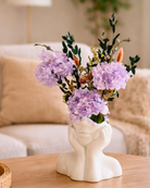 Decorative vase with purple preserved flowers on a wooden table in a living room | Fleur Reverie | Austin TX