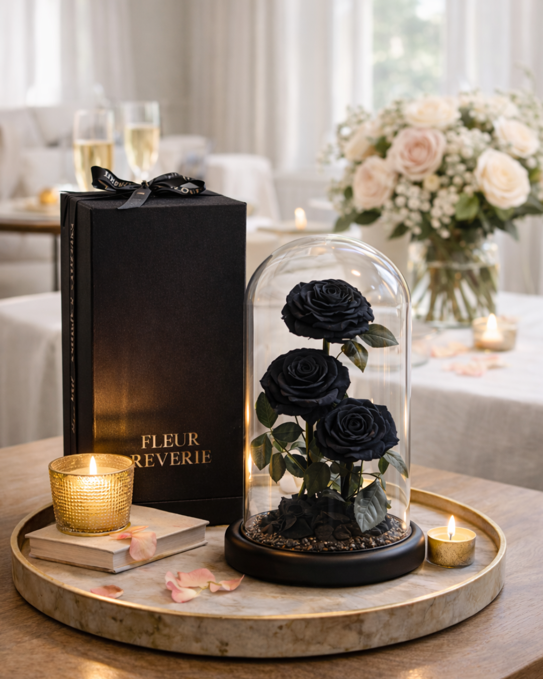 Black roses in a glass dome with 'Fleur Reverie' packaging on a wooden tray | Fleur Reverie | Austin TX