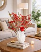 Decorative vase with red dried flowers on a coffee table in a living room| Fleur Reverie | Austin TX
