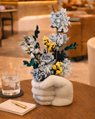 Decorative preserved flower arrangement in a unique vase 