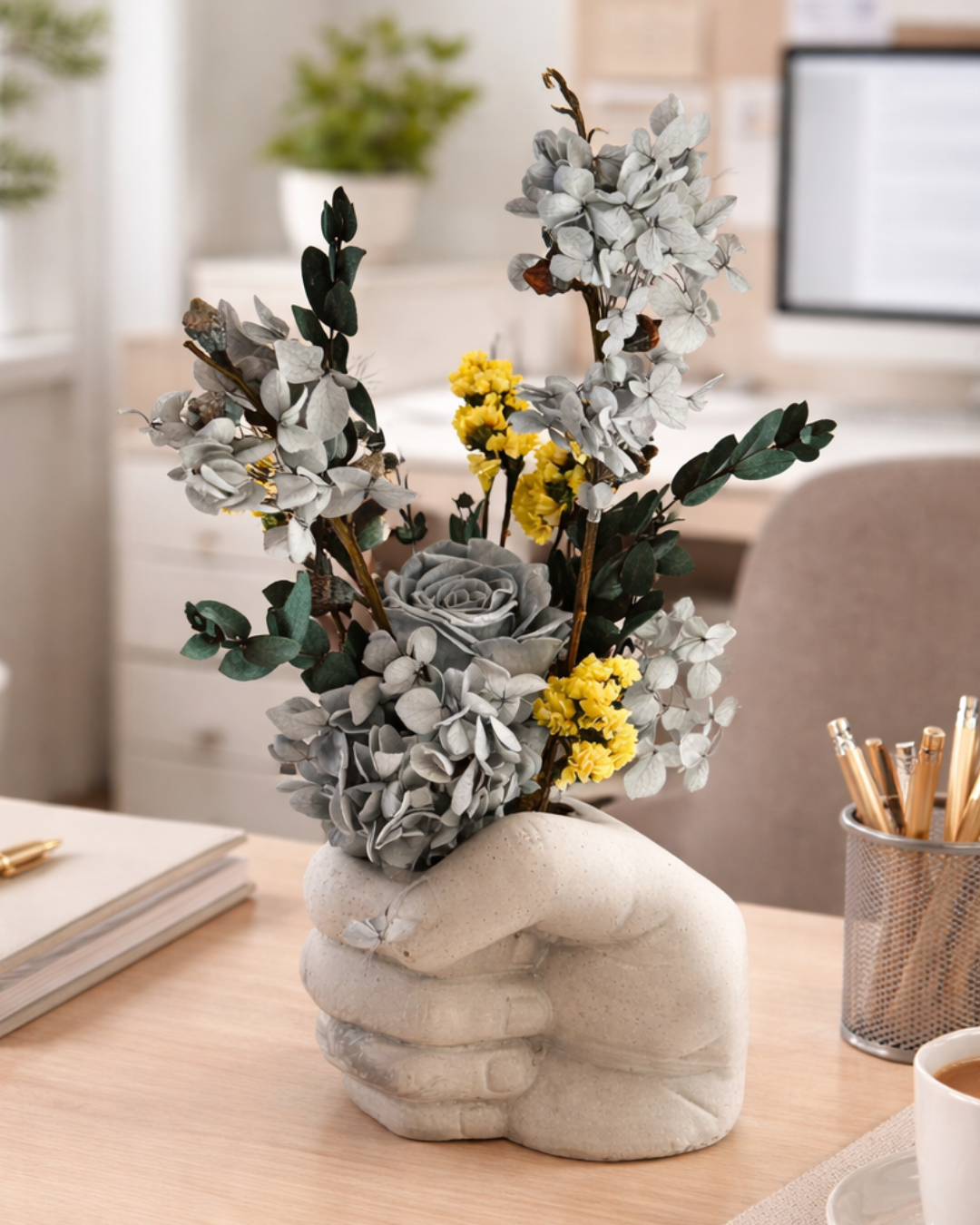 Decorative vase with flowers on a desk in an office setting | Fleur Reverie