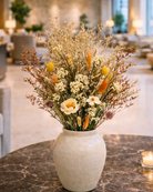 Decorative vase with dried wild flowers on a marble surface | Fleur Reverie | Austin TX